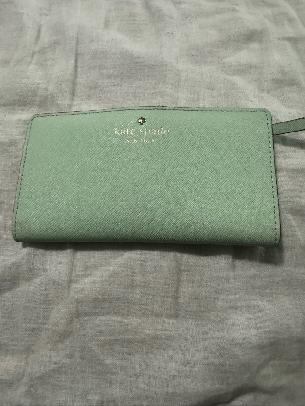 kate spade mint green wallet with gold logo